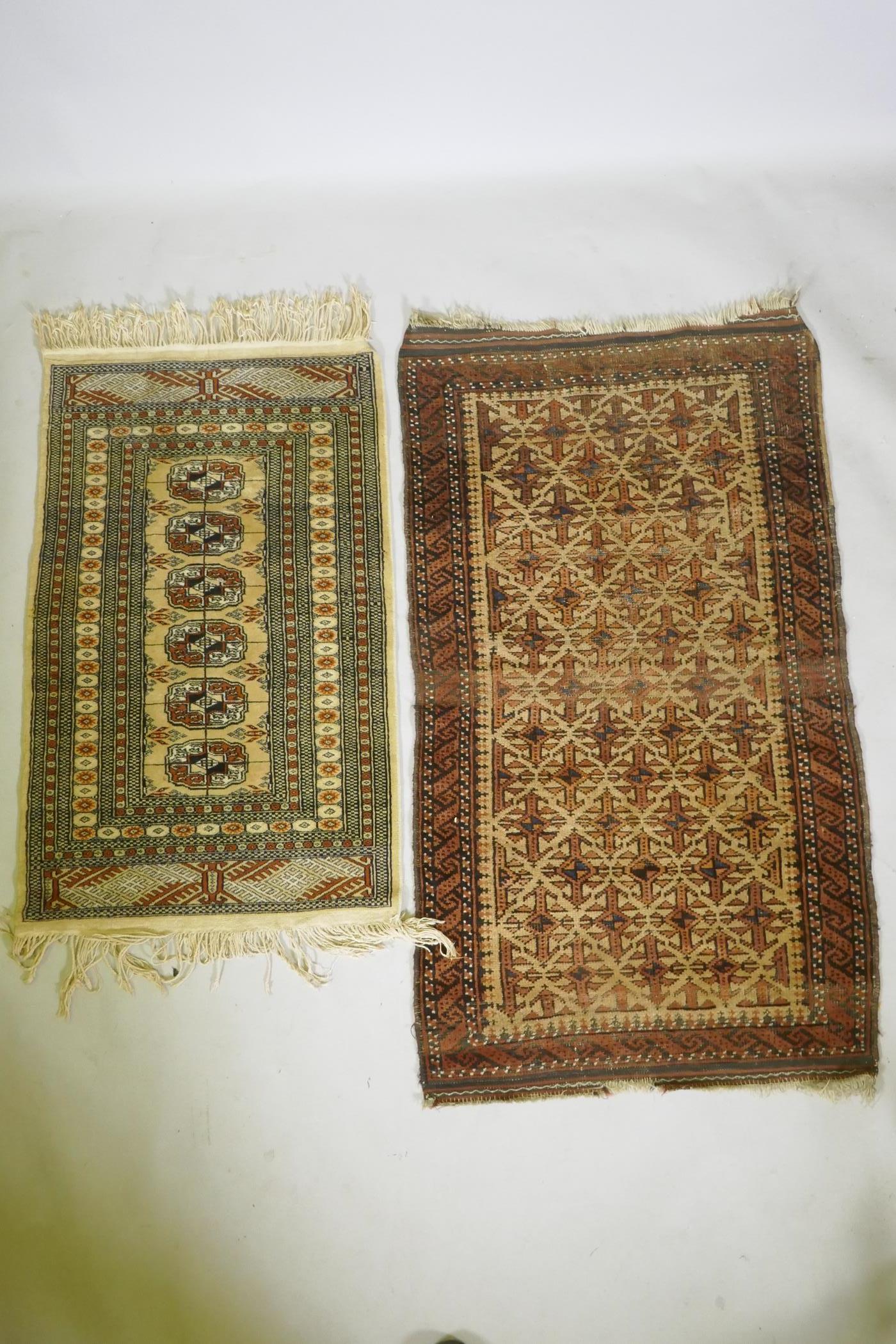 A gold ground Bokhara rug, and an Iranian rust and cream ground wool rug with an allover geometric