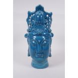 A Chinese teal glazed ceramic Quan Yin head bust, incised character inscription to base, 36cm high