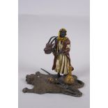 A cold painted bronze figure of an Arab merchant, 14cm high