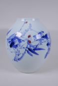 A Japanese Meiji period blue and white porcelain vase decorated with a shrub in bloom, character