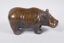 A filled bronze figure of a hippopotamus, 21cm long