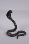 A filled bronze figure of a cobra, 18cm high