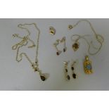 A 9ct gold necklace set with garnets and pearls and two pairs of earrings set with garnets, a