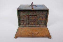 An Indian painted wood box, fitted with drawers, 29 x 23cm, 18cm high