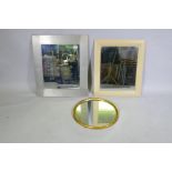 A Habitat brushed metal wall mirror, a beechwood frame mirror and gilt circular mirror