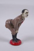 A cold painted metal figural pin cushion 12cm high