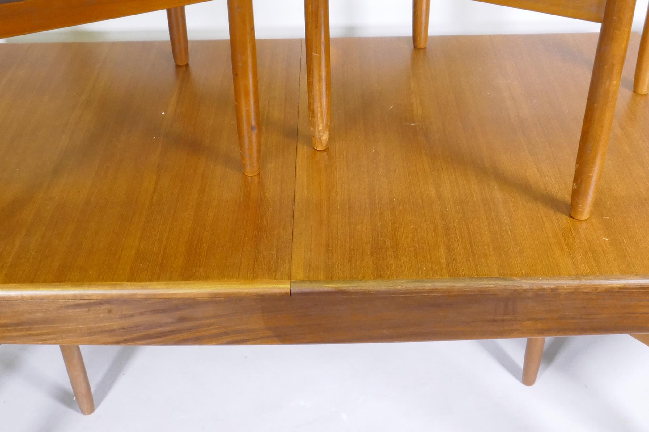 A mid century teak extending dining table, with folding leaf, designed by John Herbert for A. - Image 3 of 5