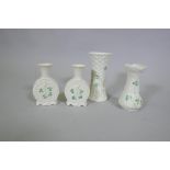 A pair of Beleek porcelain vases and two others, largest 14cm high