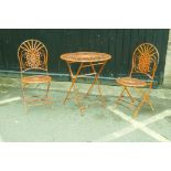 A painted metal folding bistro table and two chairs, table AF