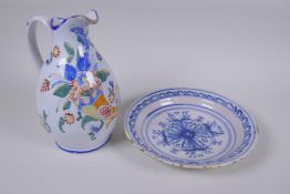 A late C18th/early C19th Delft tin glazed blue and white pottery bowl with floral decoration, and