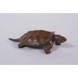 A Japanese style bronze okimono tortoise, impressed mark to base, 6cm long