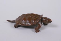 A Japanese style bronze okimono tortoise, impressed mark to base, 6cm long