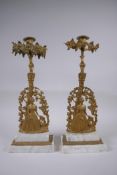 A near pair of antique ormolu and marble candlesticks in the form of a lady with a lyre, 41cm high