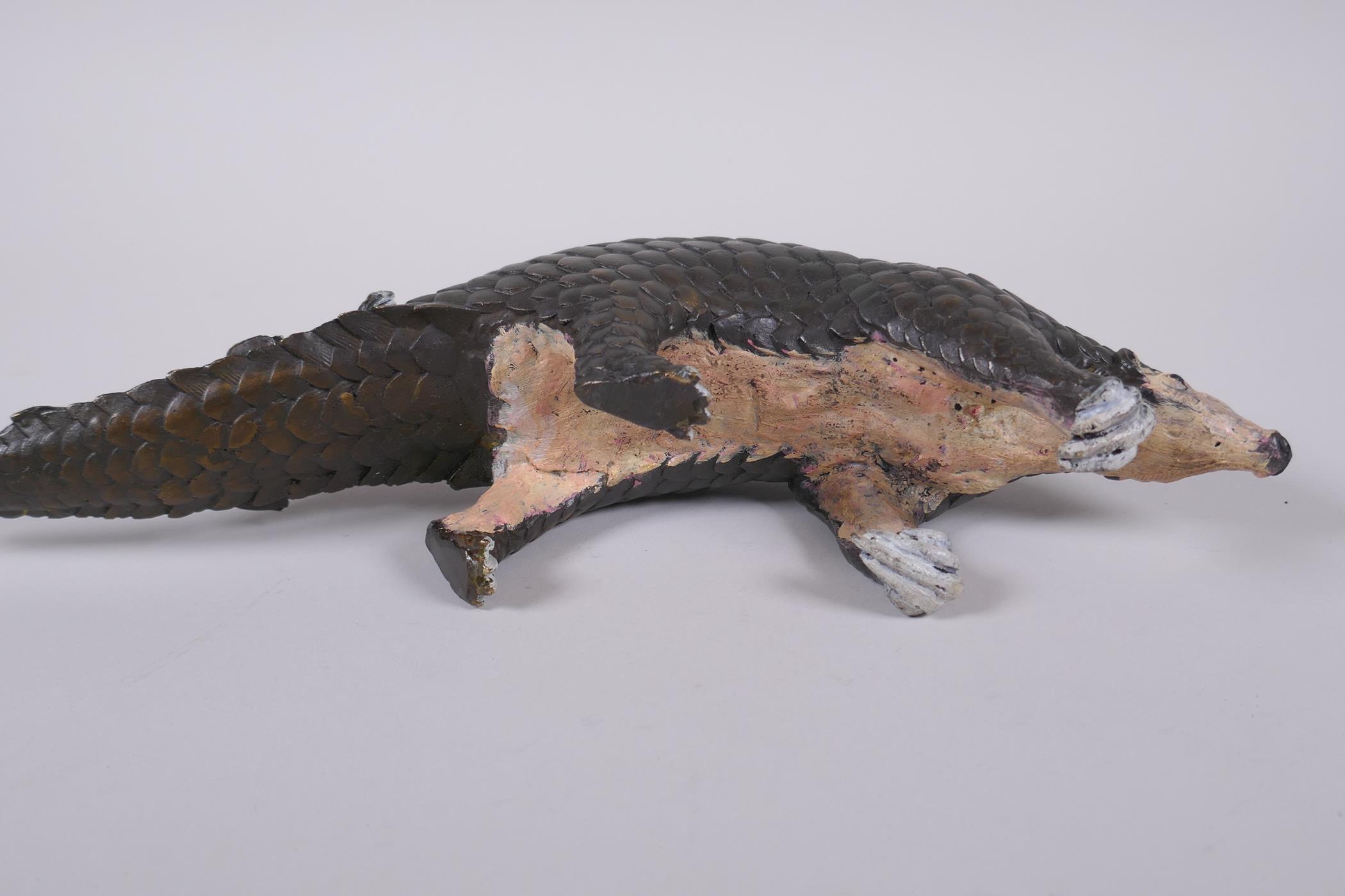 A cold painted filled bronze figure of a pangolin with a pup riding on its back, 32cm long - Image 5 of 5