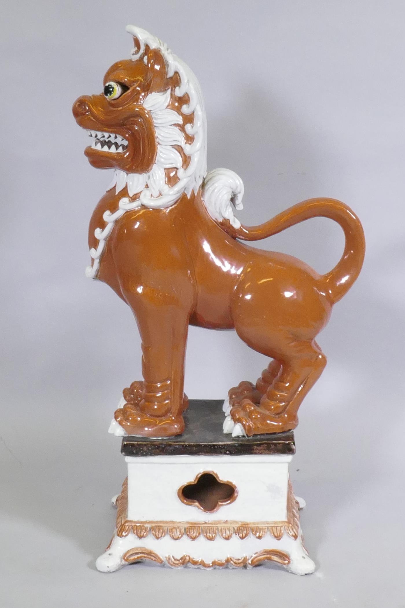 An Oriental painted and glazed terracotta figure of a temple lion, 78cm high - Image 2 of 2