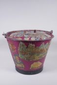 An antique painted galvanised bucket and cover, with decoupage decoration, 28cm x 35cm diameter