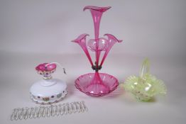 A cranberry glass epergne, a bohemian overlaid glass pendant with glass lustre drops, and a