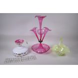 A cranberry glass epergne, a bohemian overlaid glass pendant with glass lustre drops, and a