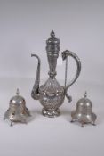 An Islamic silvered metal ewer with repousse decoration of birds and serpents, 48cm high, and two