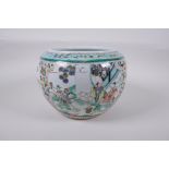 A famille vert porcelain jar with decorative panels depicting the immortals, birds and flowers,