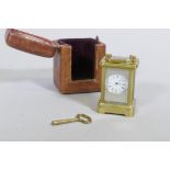 A miniature brass carriage clock, with silver and enamel dial, the movement stamped No.154522,