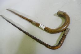 A Victorian bamboo walking cane and another, both with hallmarked silver mounts