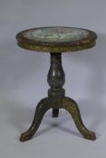 An C18th/C19th Chinese export lacquer table with inset Cantonese porcelain top, decorated with