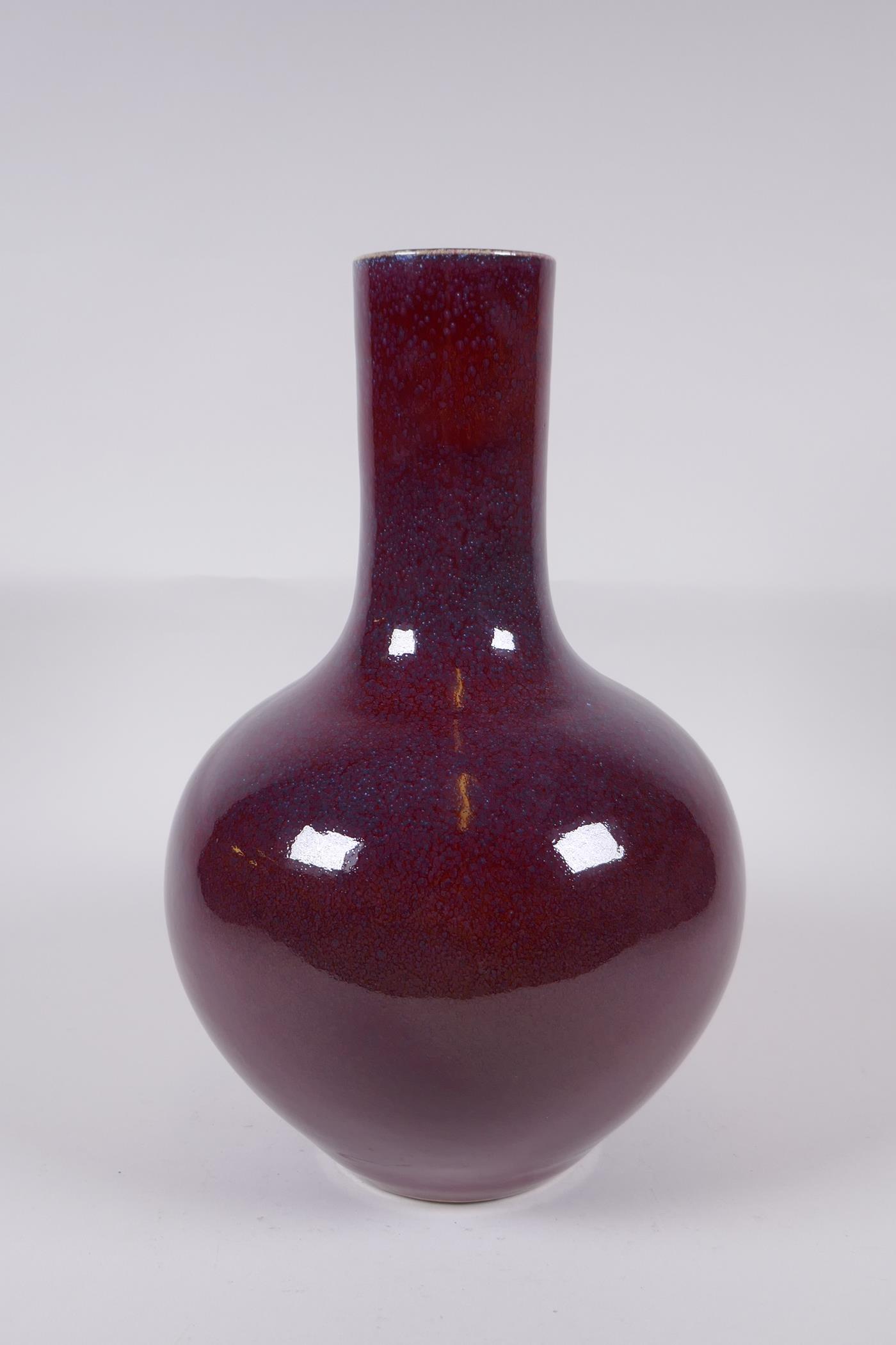 A Chinese flambe glazed porcelain bottle vase, Yong Zheng 6 character mark to base, 33cm high