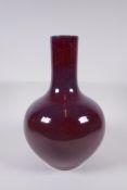 A Chinese flambe glazed porcelain bottle vase, Yong Zheng 6 character mark to base, 33cm high