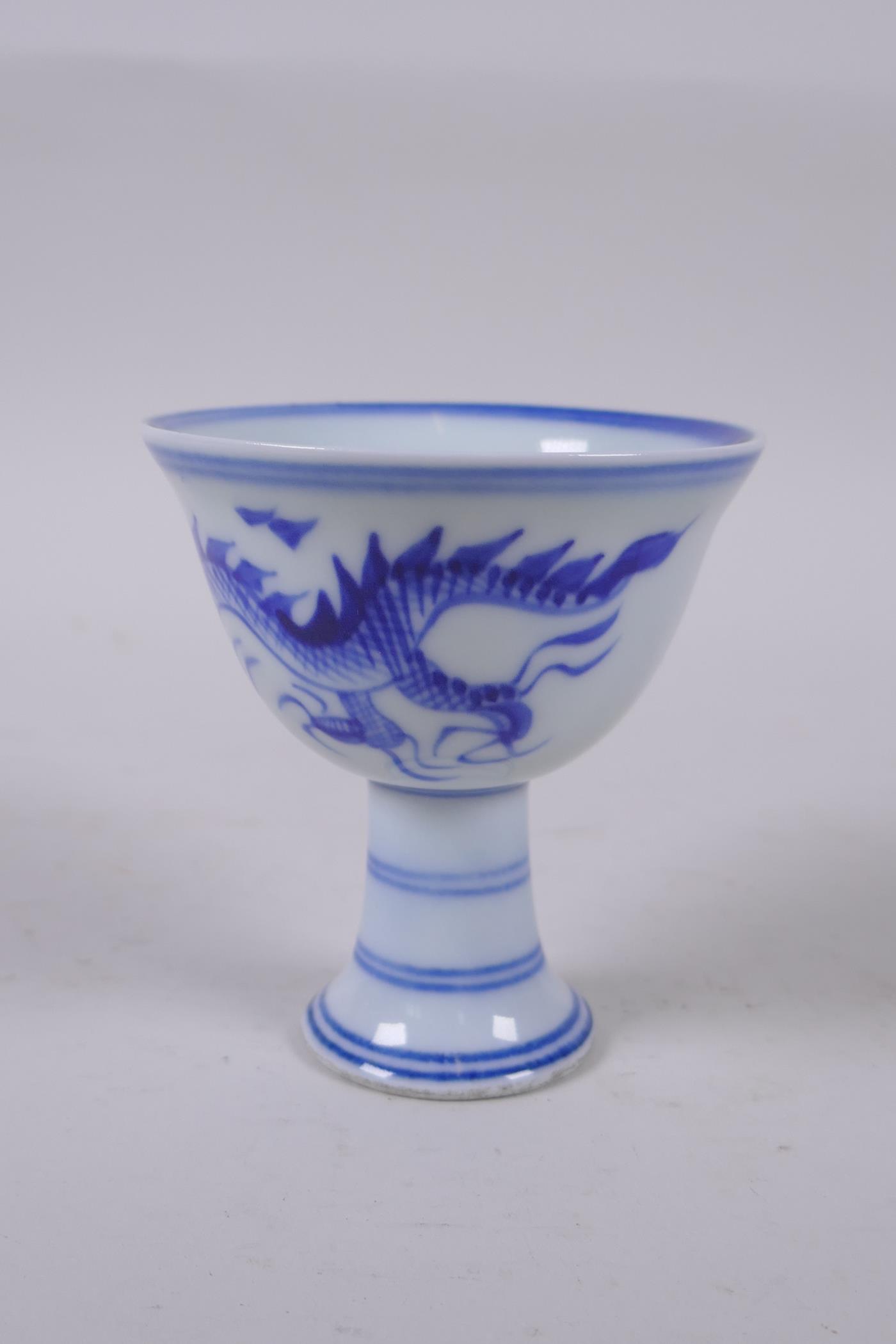 A Chinese blue and white stem cup decorated with a dragon chasing the flaming pearl, Xuande 6 - Image 2 of 4