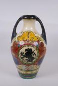 An antique Majolica amphora decorated with rampant lions, 38cm high