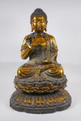 A large Chinese gilt bronze figure of Buddha seated on a lotus throne, 6 character mark to back,