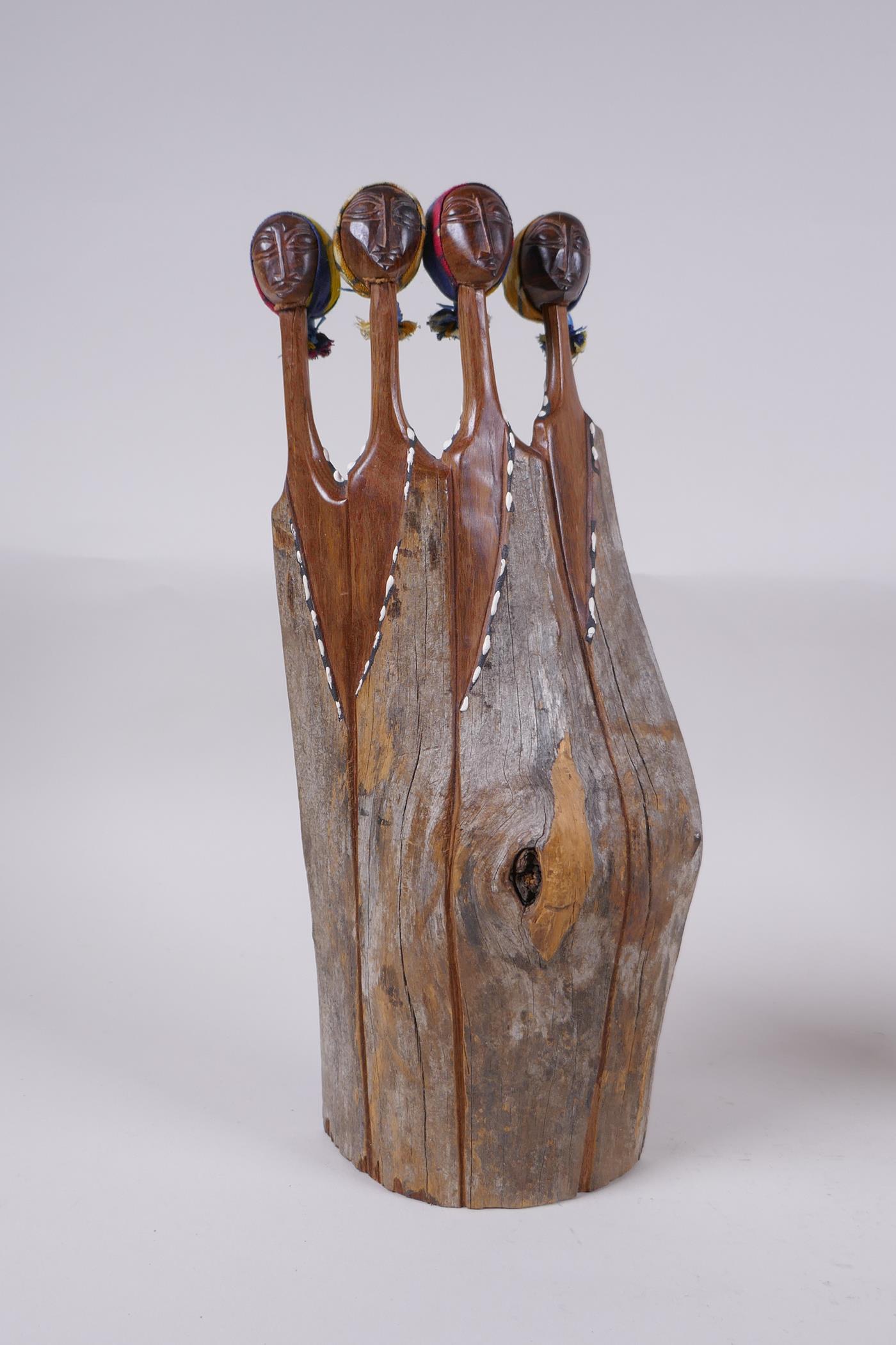 Two African carved hardwood female figure groups with traditional material headdresses, and an - Image 2 of 7