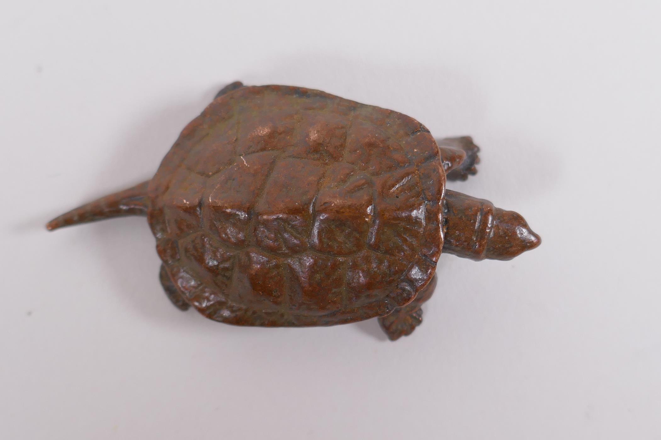 A Japanese style bronze okimono tortoise, impressed mark to base, 6cm long - Image 2 of 3