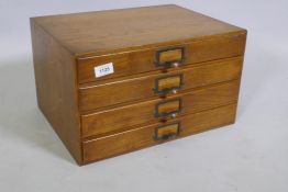 A vintage oak four drawer filing cabinet, 43 x 32 x 25cm