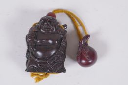 A Japanese carved hardwood Buddha inro with boxwood netsuke sack, the base with inset signed abalone