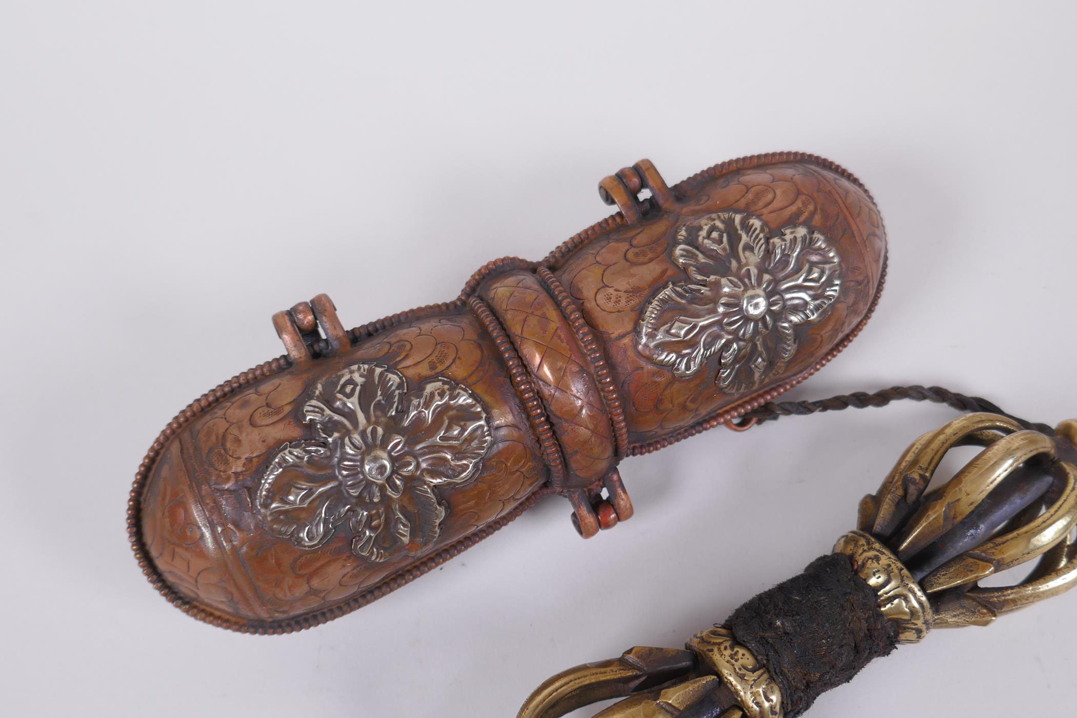 A Tibetan bronze vajra in a repousse copper carry case, 18cm long - Image 3 of 4