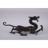 A Chinese filled bronze dragon, 31cm long