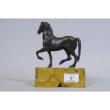 A C19th Grand Tour bronze figure of a horse, mounted on a marble base, 18cm high