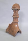 A terracotta ridge tile finial, 63cm high