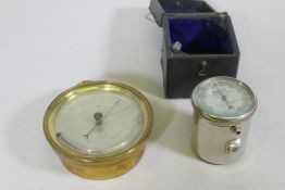 An antique brass cased aneroid barometer, the silvered dial inscribed E.J. Dent, Paris, 12cm