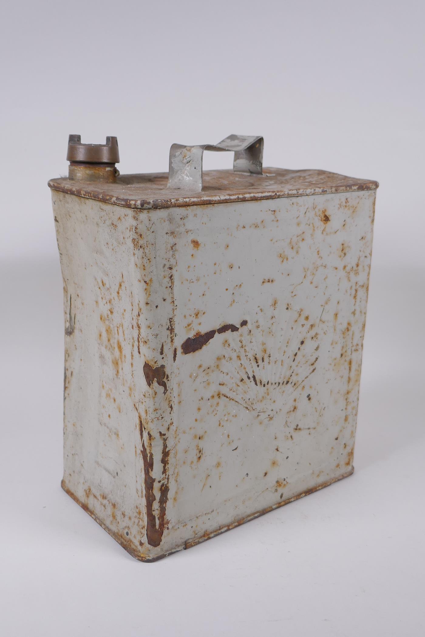 A vintage metal Shell Oil petrol can, 25 x 15cm, 32cm high