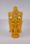 A Chinese yellow crackle glazed porcelain Quanyin head bust, impressed twin character mark to