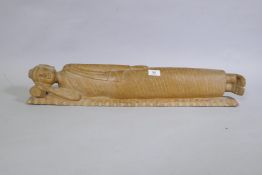 A carved wood figure of sleeping Buddha, 72cm long