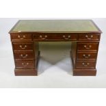 A mahogany pedestal desk, with nine drawers and a leather inset top, 137 x 70cm, 78cm high