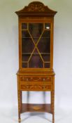 A Georgian inlaid mahogany display cabinet, the upper section with single astragal glazed door,
