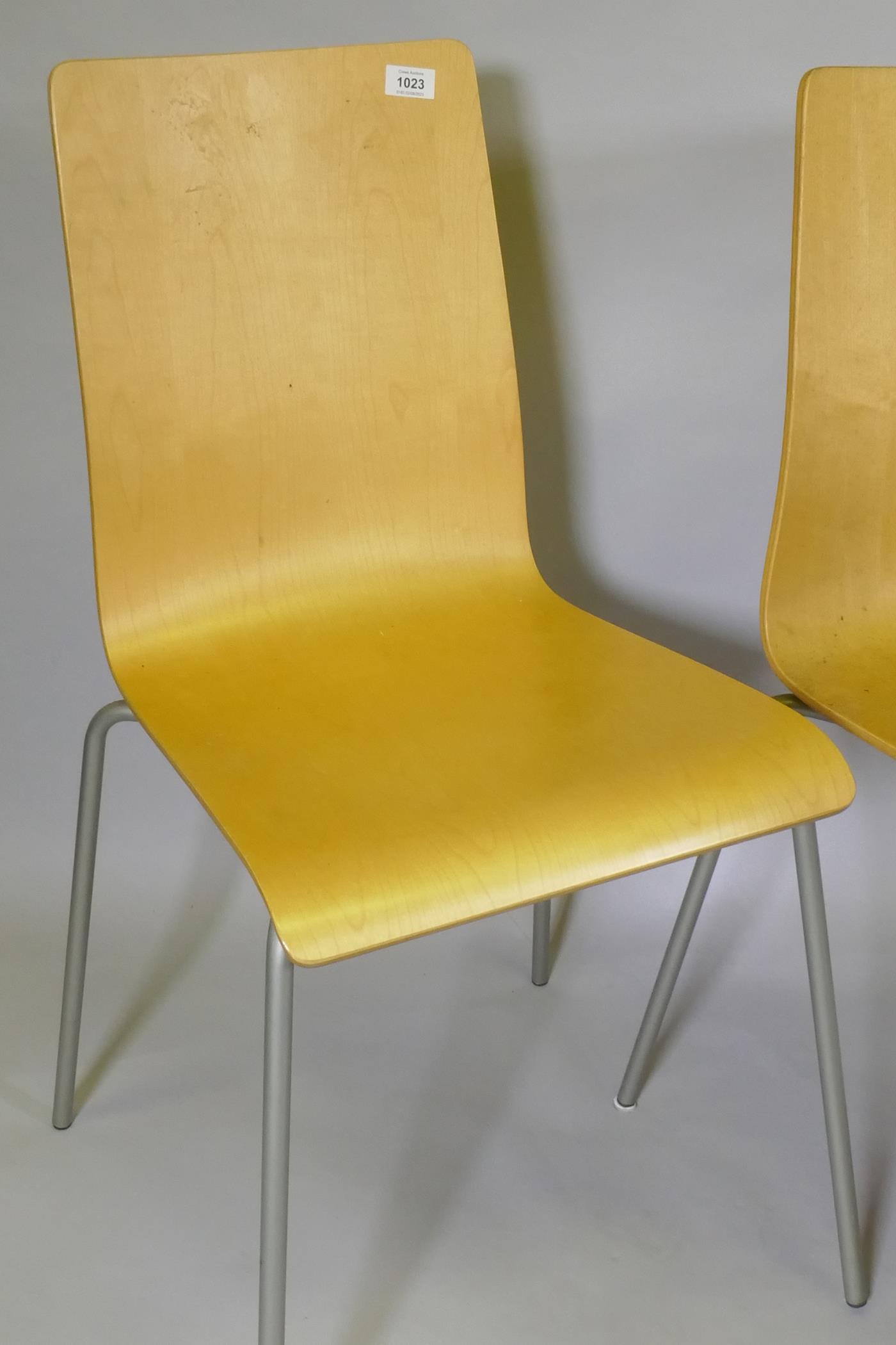 A set of four contemporary stacking bent plywood chairs in birchwood veneer - Image 2 of 3