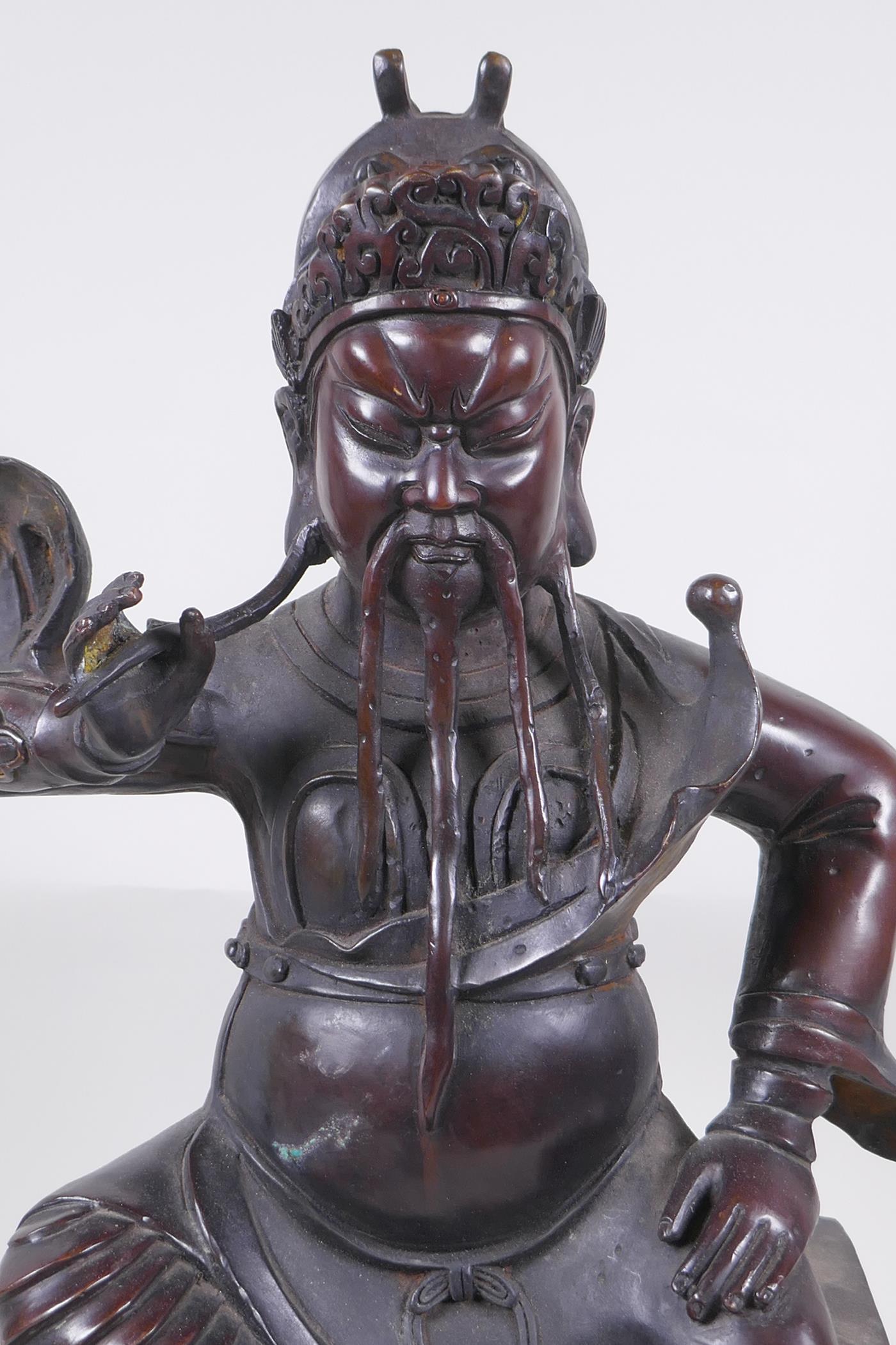 A large Chinese bronze figure of an immortal warrior seated on a throne, 45cm high - Image 2 of 5