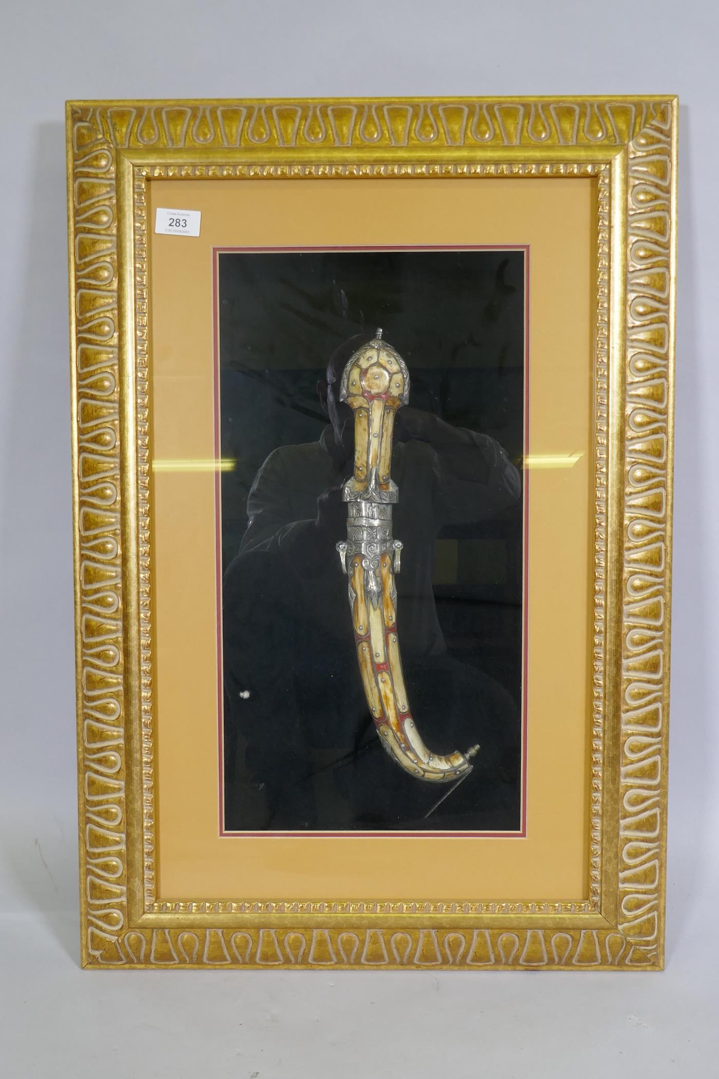An Arab Jambiya dagger, mounted in a gilt frame, 55 x 80cm