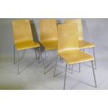 A set of four contemporary stacking bent plywood chairs in birchwood veneer